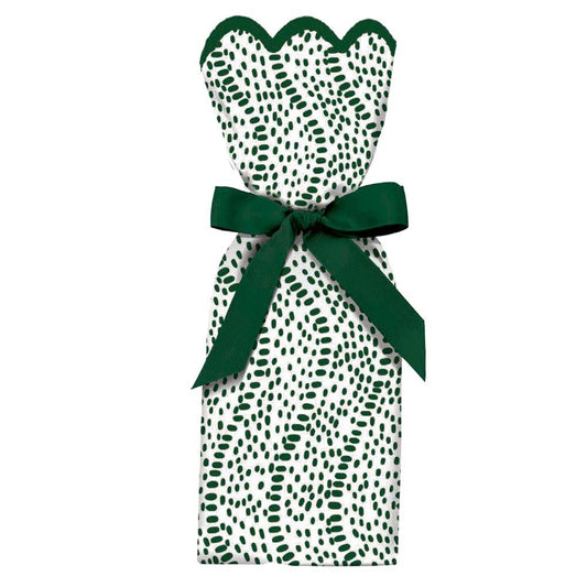 Wine and gift bag with green dot patter and a bow around it