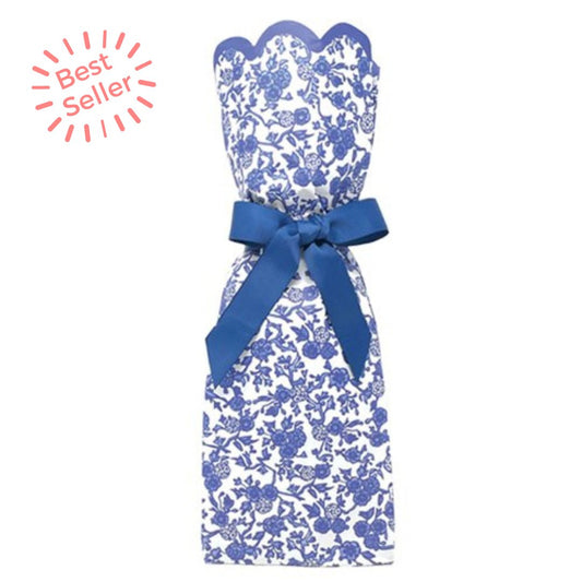 Wine and gift bag kit in blue and white chinoiserie pattern with a blue ribbon tied around it