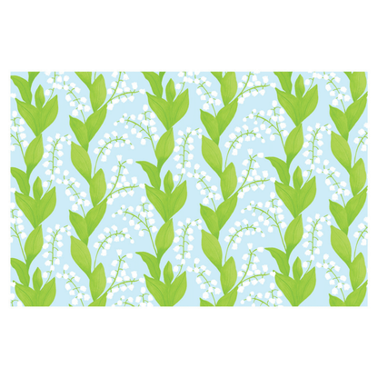 Pattern of green leaves and white flowers on a blue background