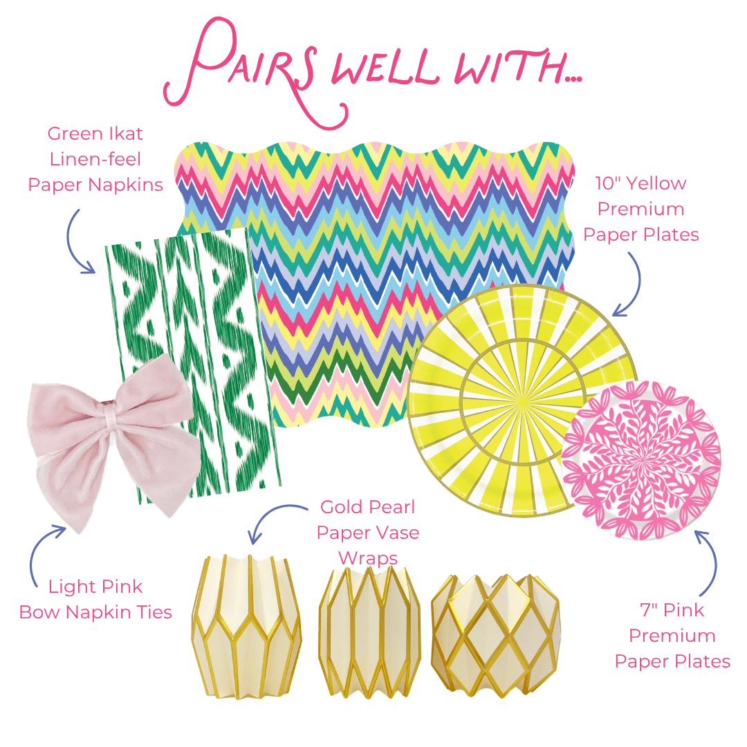 Graphic showing coordinating table decor items including green ikat-style paper napkins, multicolored zigzag placemat, yellow striped and pink floral paper plates, light pink bow napkin ties, and gold geometric paper vase wraps, labeled as items that pair well together.