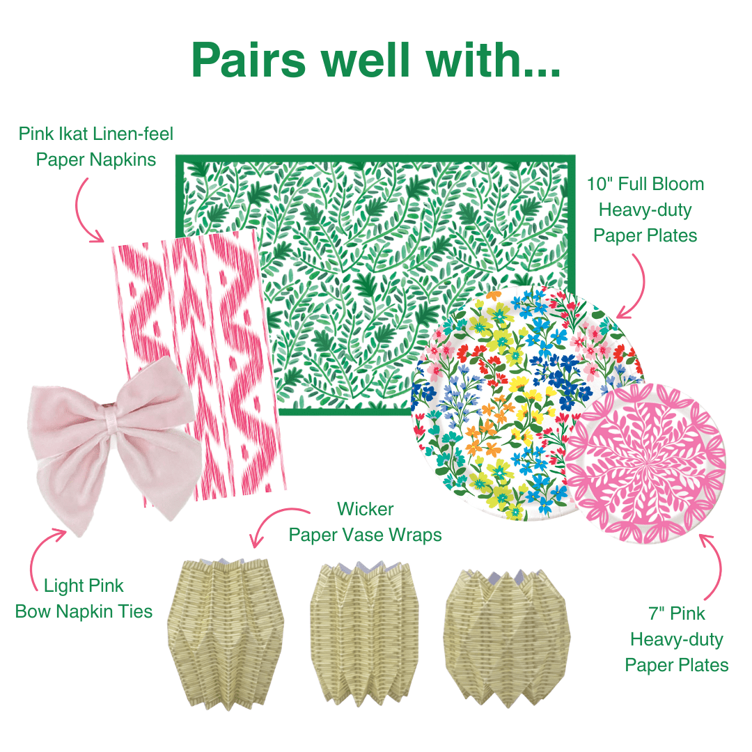 Product assortment with pink ikat linen-feel paper napkins, green floral-patterned paper, colorful floral paper plates, light pink bow napkin ties, wicker paper vase wraps, and pink heavy-duty paper plates.
