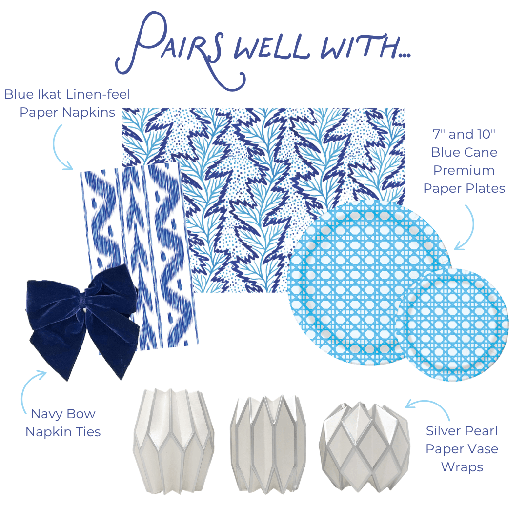 Pairs well with graphic showing five coordinating party products: Blue Ikat Linen-feel Paper Napkins in a blue and white ikat stripe pattern; Navy Bow Napkin Ties in deep navy velvet; Silver Pearl Paper Vase Wraps in pearlescent silver with a geometric lattice; a blue and white botanical leaf print background; and 7-inch and 10-inch Blue Cane Heavy-duty Paper Plates in light blue with a woven cane grid pattern