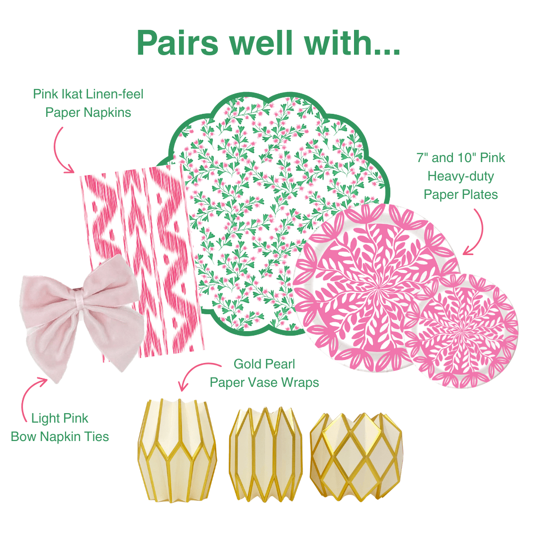 Pairs well with graphic showing six coordinating party products: Pink Ikat Linen-feel Paper Napkins in a pink and white ikat stripe pattern; Light Pink Bow Napkin Ties in soft pink velvet; Gold Pearl Paper Vase Wraps in cream and ivory with gold geometric lattice; a green scallop-edged placemat with a pink and green floral sprig print; and 7-inch and 10-inch Pink Heavy-duty Paper Plates with a bold pink floral medallion print