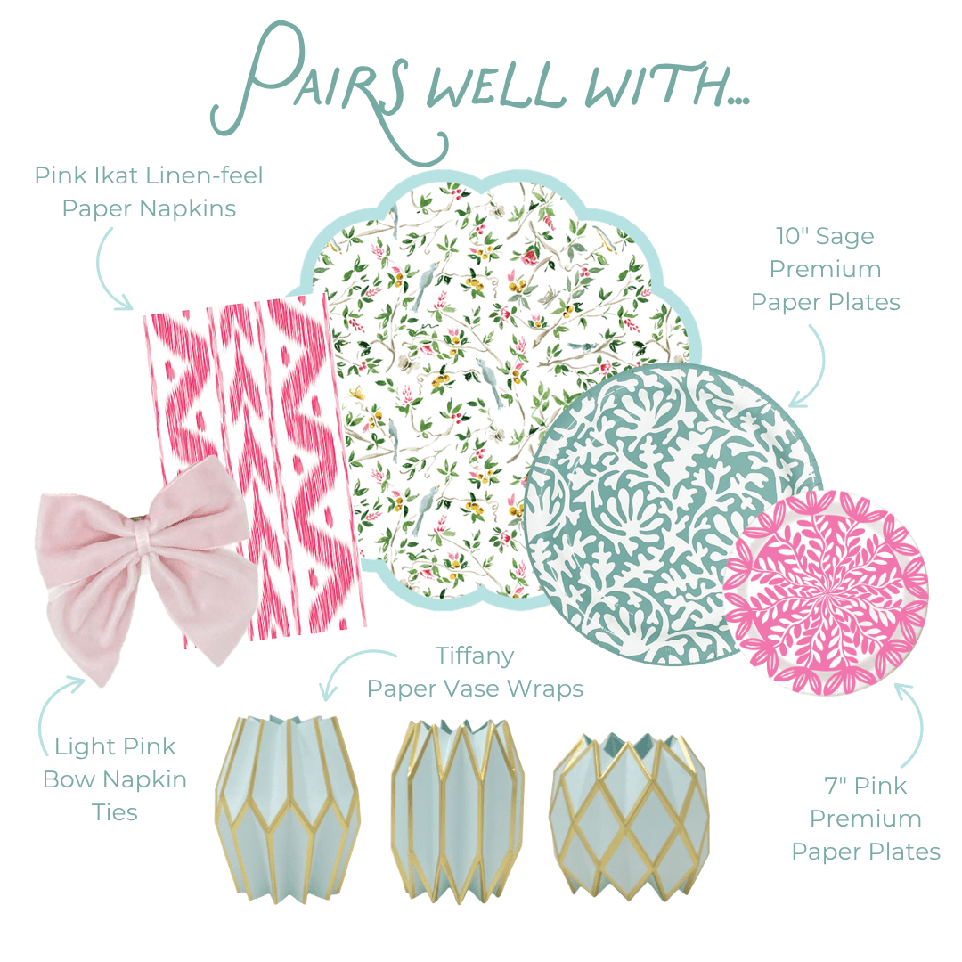Pairs well with graphic showing coordinating party products: Pink Ikat Linen-feel Paper Napkins in a pink and white ikat pattern; Light Pink Bow Napkin Ties in soft pink velvet; Tiffany Paper Vase Wraps in pale blue with gold geometric lattice; a light blue scallop-edged placemat with a delicate floral and bird branch print in pink, green, and white; 10-inch Sage Heavy-duty Paper Plates in teal with a white damask floral medallion print; and 7-inch Pink Heavy-duty Paper Plates