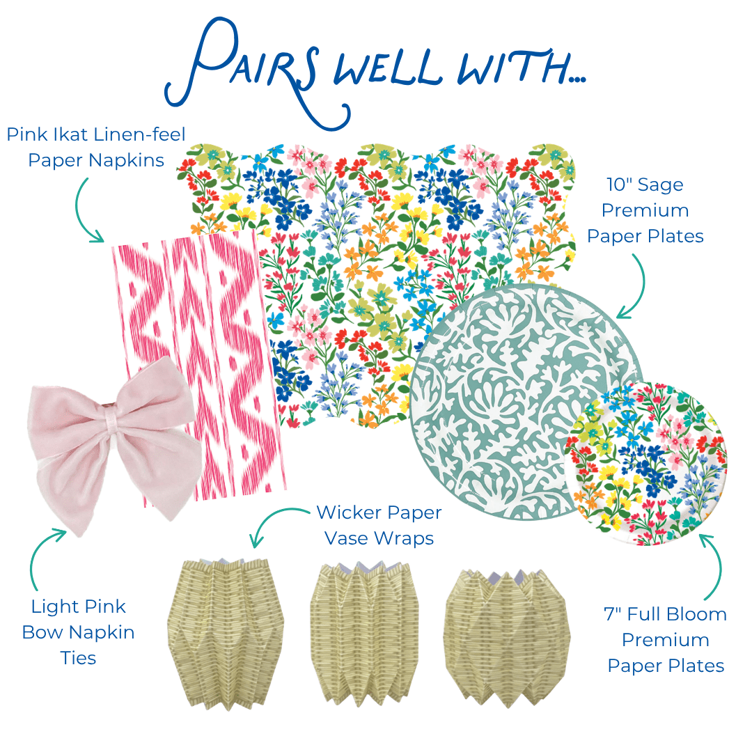 Graphic showing coordinating table decor items including pink ikat-style paper napkins, multicolor floral scalloped placemat, sage green and floral-patterned paper plates, light pink bow napkin ties, and wicker-style paper vase wraps, labeled as items that pair well together.