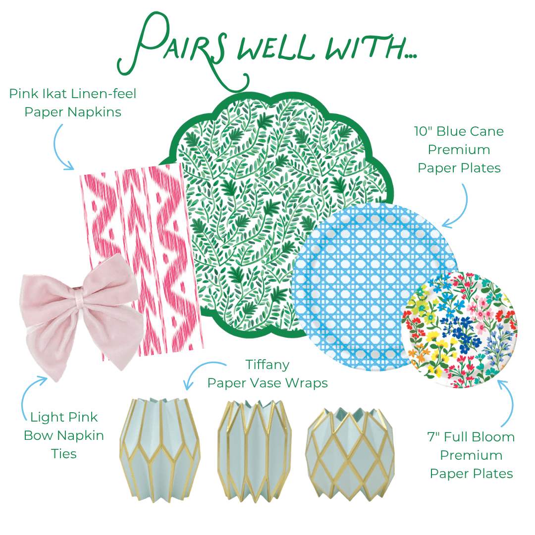 Pairs well with graphic showing six coordinating party products: Pink Ikat Linen-feel Paper Napkins in a pink and white ikat stripe pattern; Light Pink Bow Napkin Ties in soft pink velvet; Tiffany Paper Vase Wraps in pale blue with gold geometric lattice; a green and white botanical leaf print scallop-edged plate or charger; 10-inch Blue Cane Heavy-duty Paper Plates in light blue with a woven cane grid pattern; and 7-inch Full Bloom Heavy-duty Paper Plates with a colorful wildflower print
