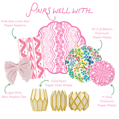 Graphic showing coordinated party tableware: pink ikat napkins with light pink bow ties, pink patterned placemat, floral and pink plates, and gold paper and pearlescent vase wraps.