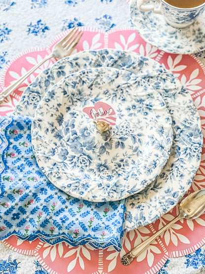 Spring tablescape with our English Garden pink and white vine scalloped paper placemats