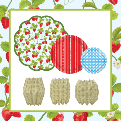 Set of paper plates and napkins with strawberry design on a strawberry-themed background