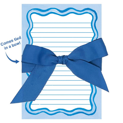 Lined notepad with blue wavy border tied in a bow