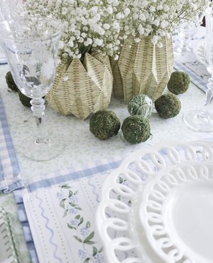 Floral paper placemats with green cabbage dishes