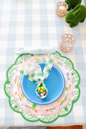 Easter table setting with round paper placemats