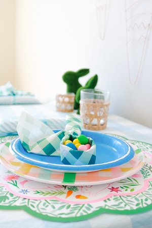 Easter table setting with round paper placemats