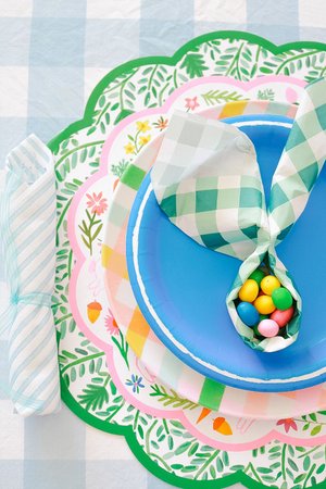 Easter table setting with round paper placemats
