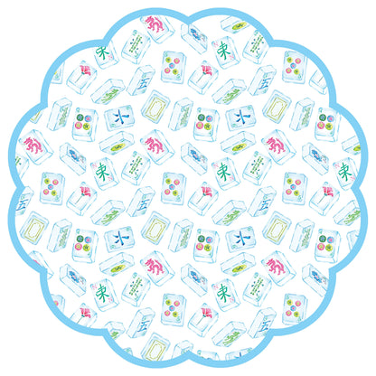Blue scalloped paper placemat with mahjong tile designs on a white background