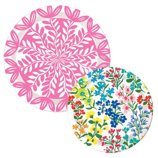 Two paper plates: a pink botanical leaf-print dinner plate and a multicolor wildflower bouquet dessert plate