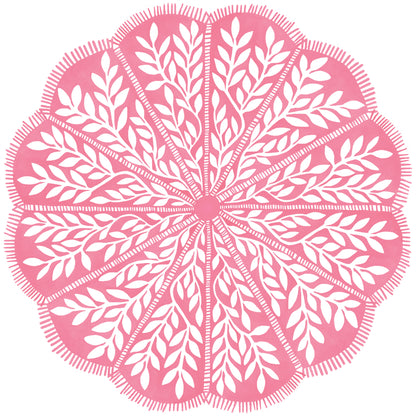 Round scalloped paper placemats featuring a pink and white vine pattern