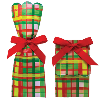 Two paper gift bag kits in a red, green, and yellow plaid print, shown tied as a tall wine bag and a shorter gift bag, each with a red ribbon bow