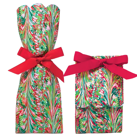 Two paper gift bag kits in a red, green, and pink marbled swirl print, shown tied as a tall wine bag and a shorter gift bag, each with a red ribbon bow