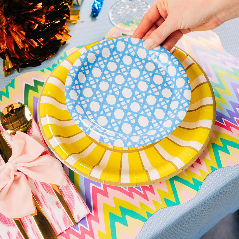 Colorful summer paper plates on top of a zigzag patterned paper placemat