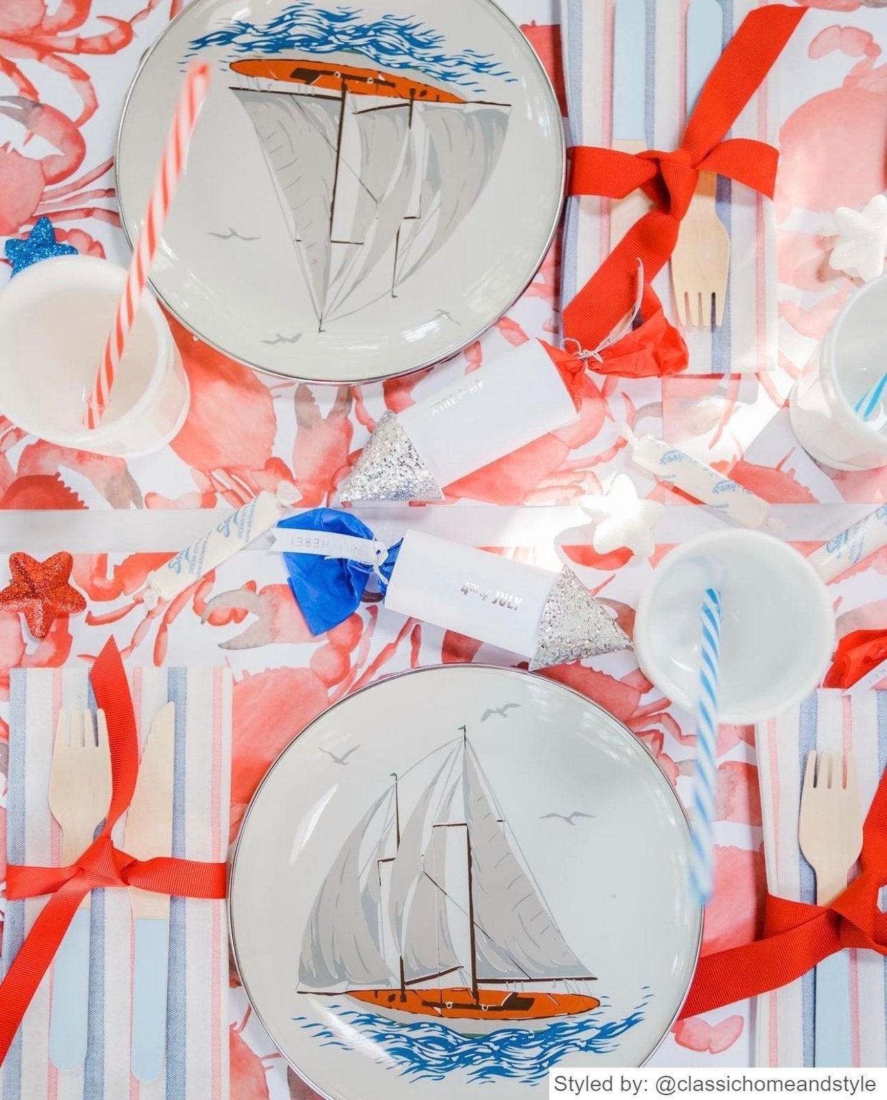 Red, white and blue table setting with red and white crab paper placemats and a blue andw whitesailboat plate