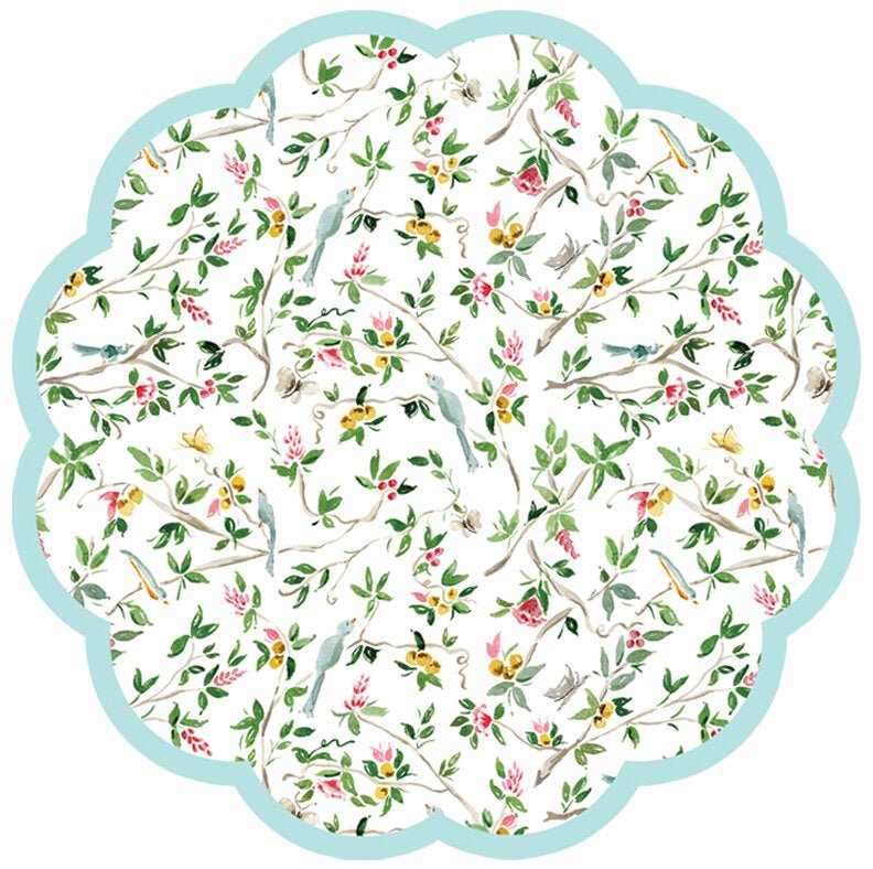 Round scalloped paper placemat featuring a chinoiserie pattern with birds on a cream colored background.