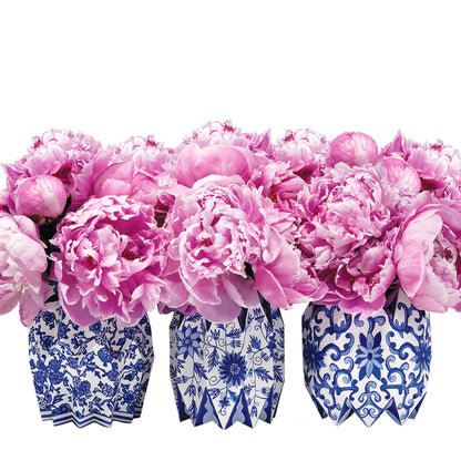Blue and white chinoiserie patterned paper sleeve vases with purple flowers