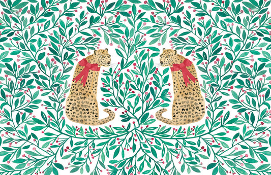 Holly berry patterned paper placemat with two leopards