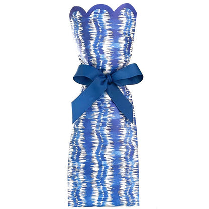 Paper wine bag with blue and white ikat pattern and blue bow