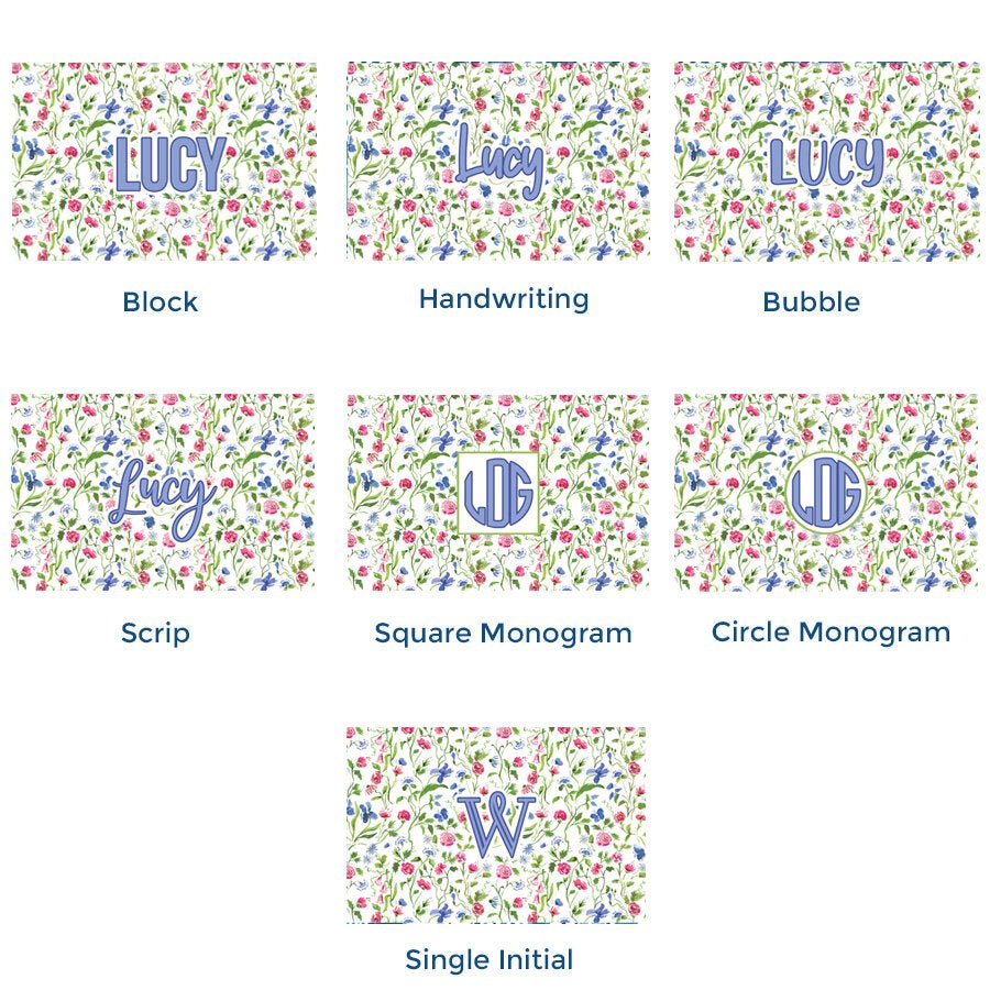 Paper placemat pads featuring a floral pattern on a cream background with various periwinkle personalization options