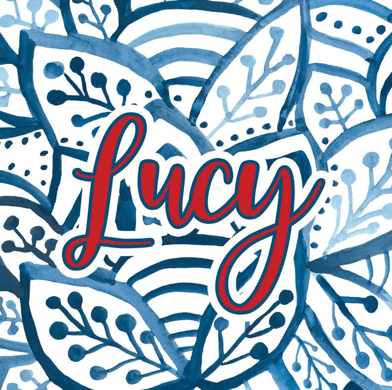 Paper placemat featuring a blue and white leaf pattern and red personalization