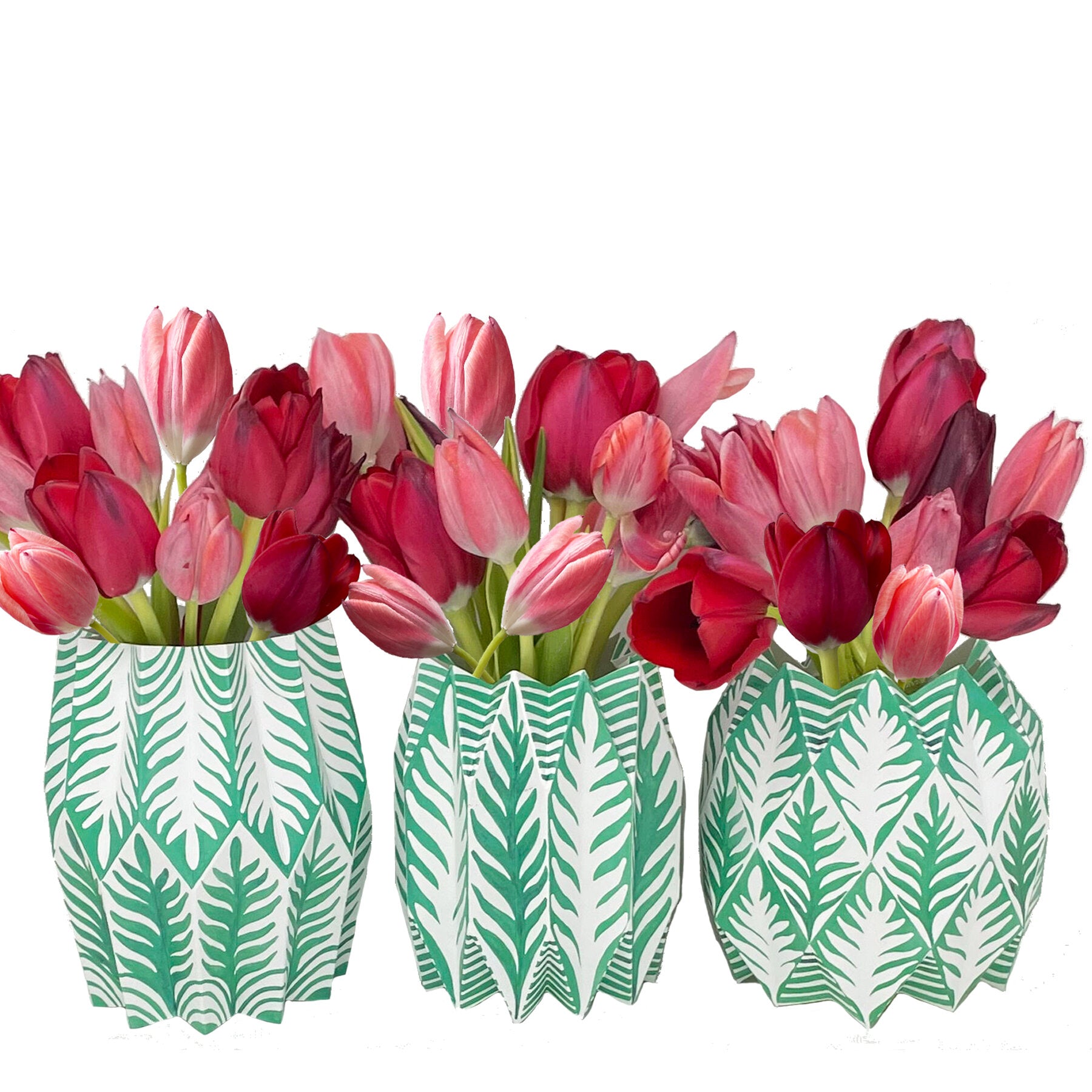 Green and white fern patterned paper vases with red tulips