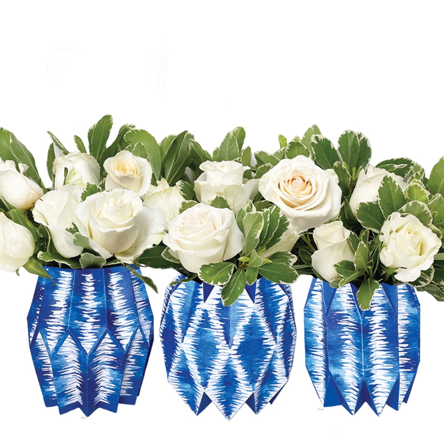 Blue ikat patterned paper vases with white roses