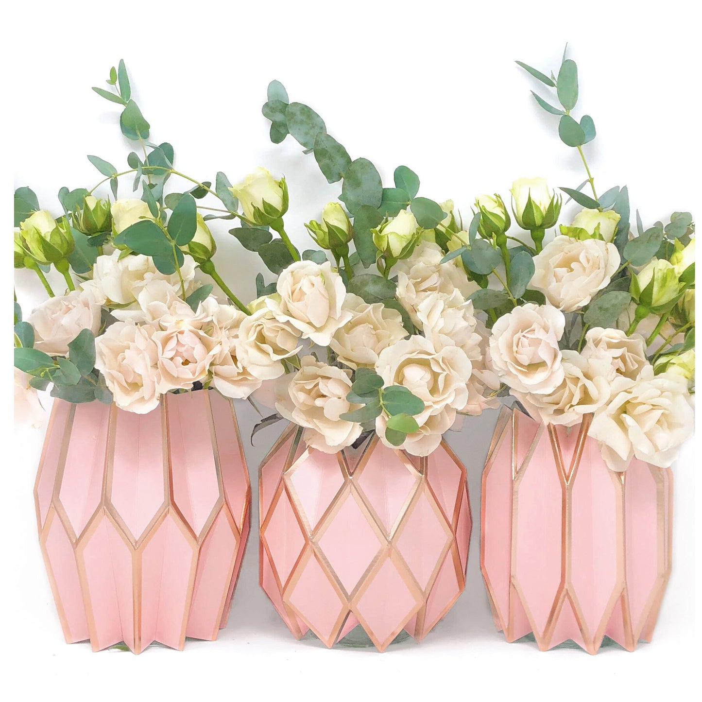 Pink and rose gold paper sleeve vases with white roses