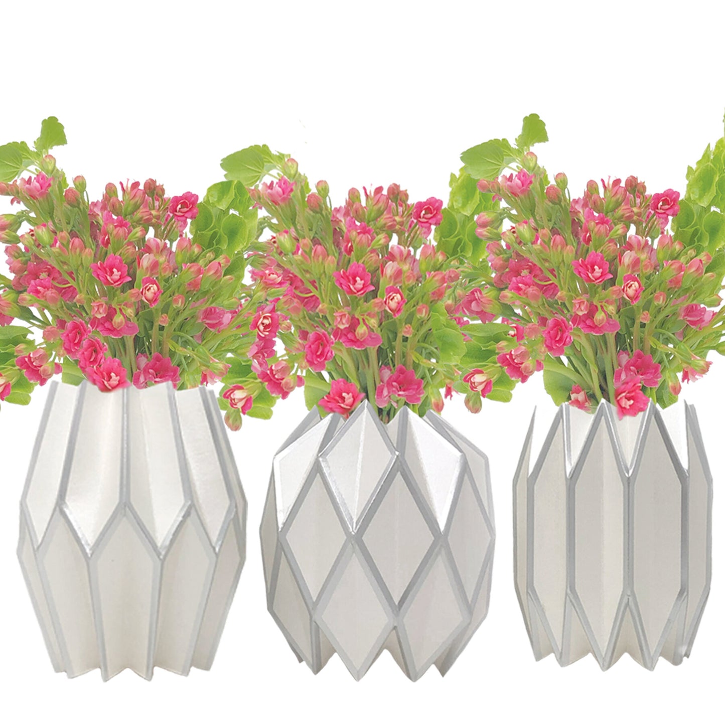 Silver and white paper vase sleeve centerpieces with pink flowers