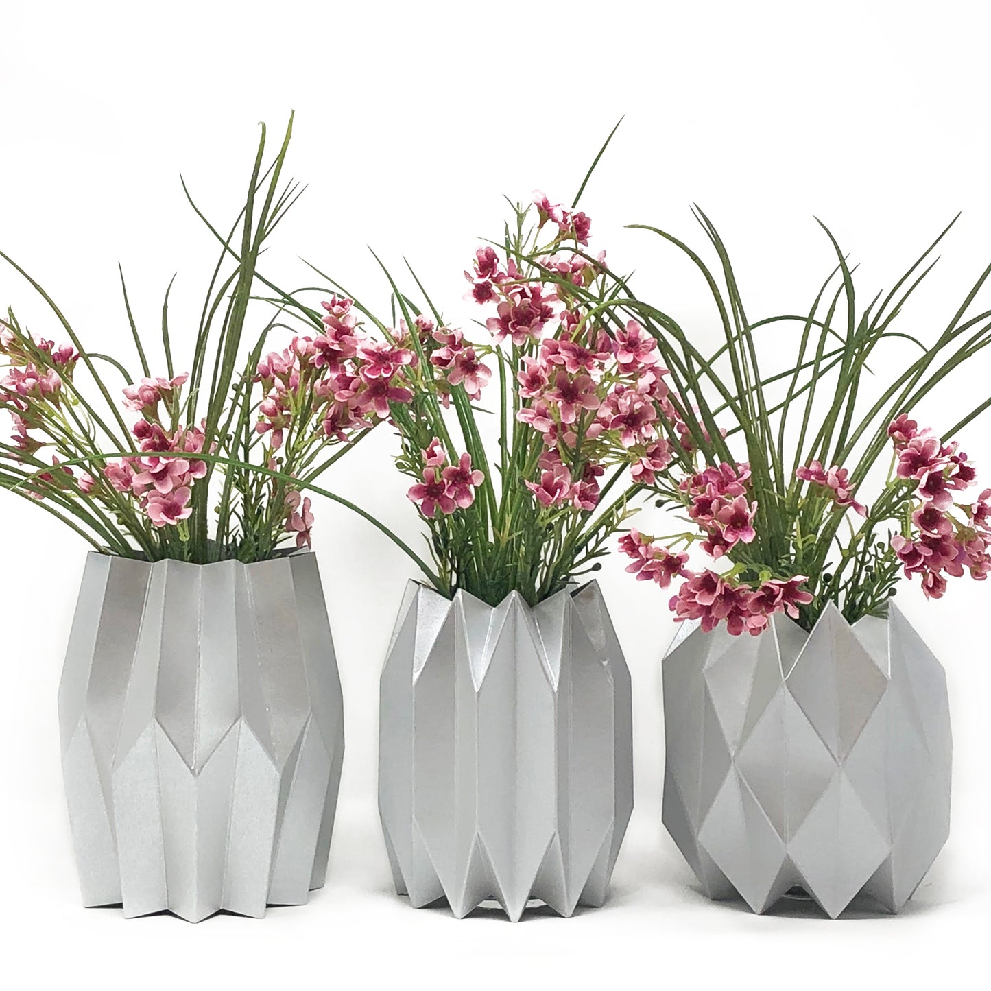 Silver Paper Vase Sleeve Centerpieces with pink flowers