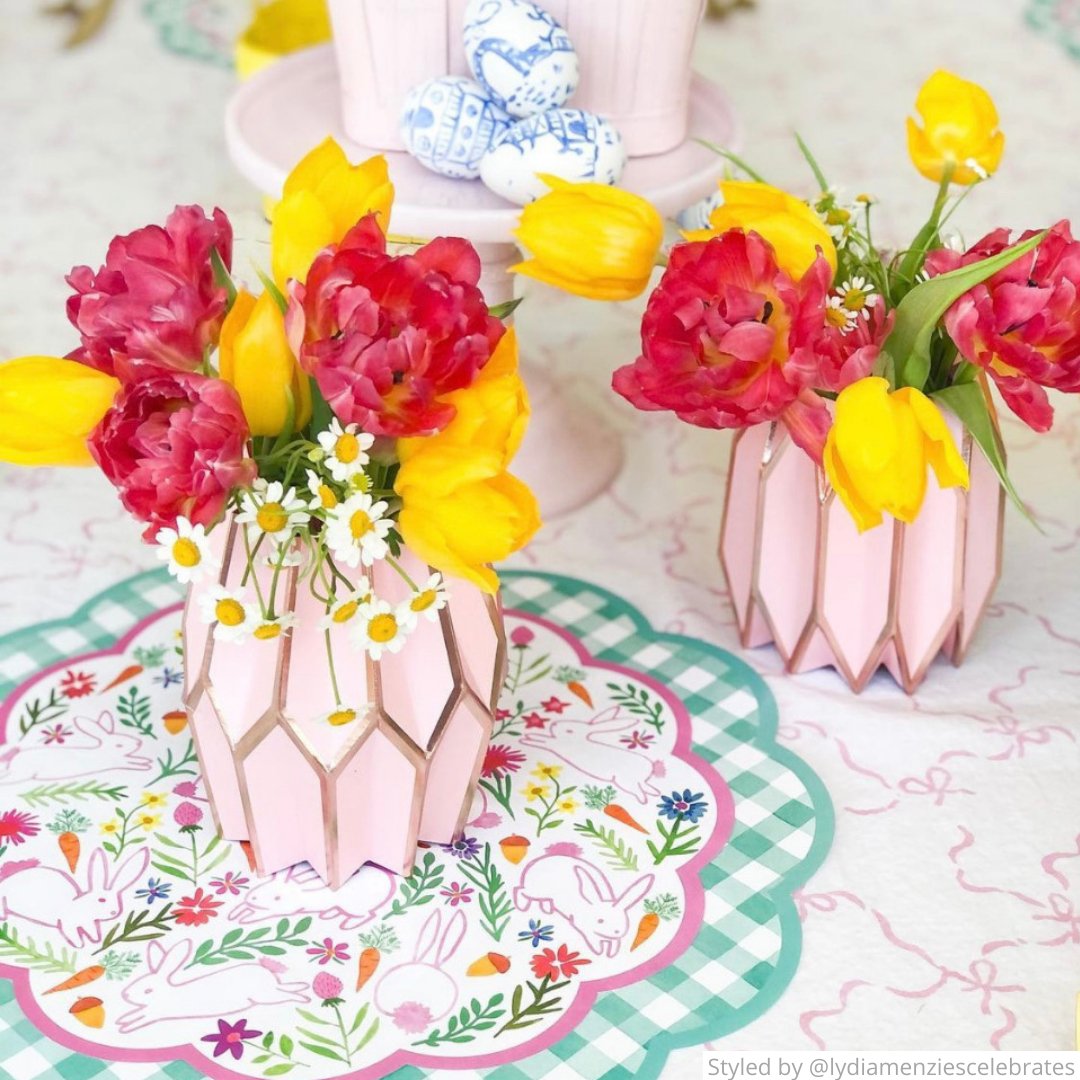 Table setting with paper placemat and pink paper vases