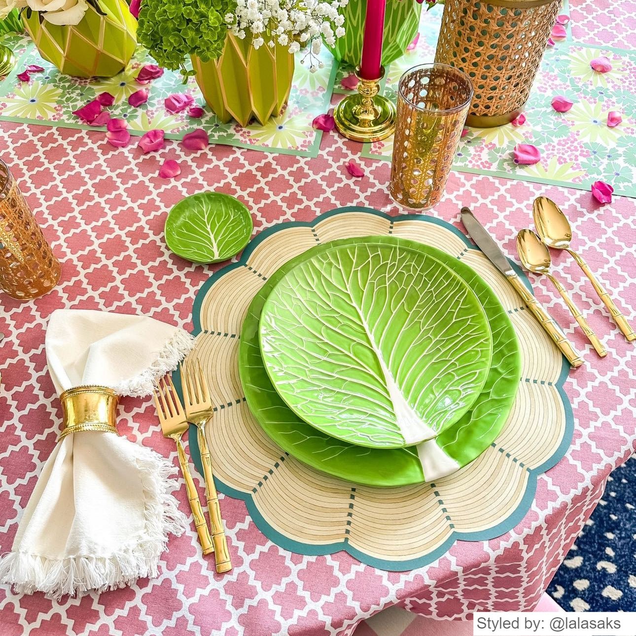 Pink and green summer tablescape with round wicker patterned paper placemats